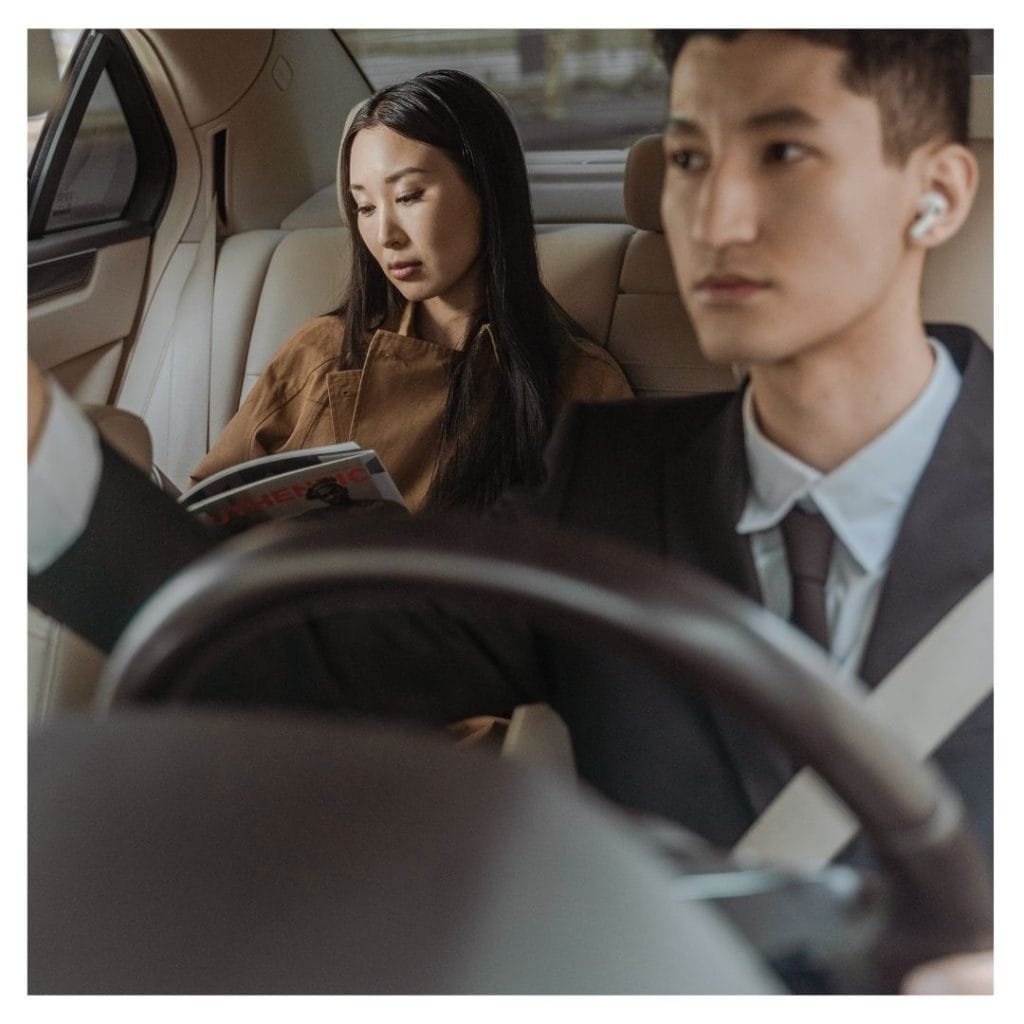 chauffeur driving business person